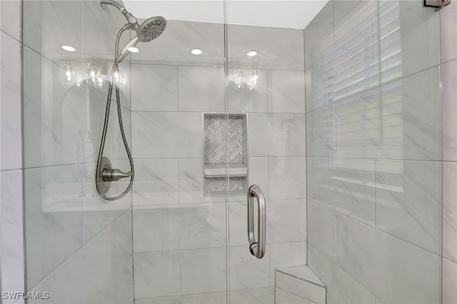 773 Wiggins Lake Dr Unit 101, Naples, FL 34110 - bathroom featuring a stall shower and recessed lighting