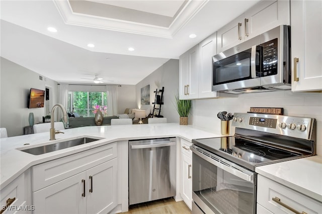 773 Wiggins Lake Dr Unit 101, Naples, FL 34110 - kitchen featuring stainless steel appliances, a sink, recessed lighting, white cabinets, and open floor plan