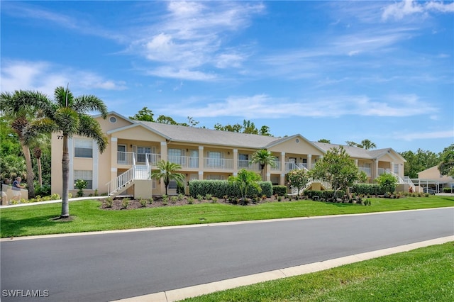 773 Wiggins Lake Dr Unit 101, Naples, FL 34110 - multi unit property with a front lawn and stairs