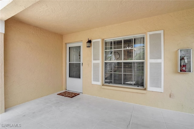 773 Wiggins Lake Dr Unit 101, Naples, FL 34110 - entrance to property with stucco siding and a patio