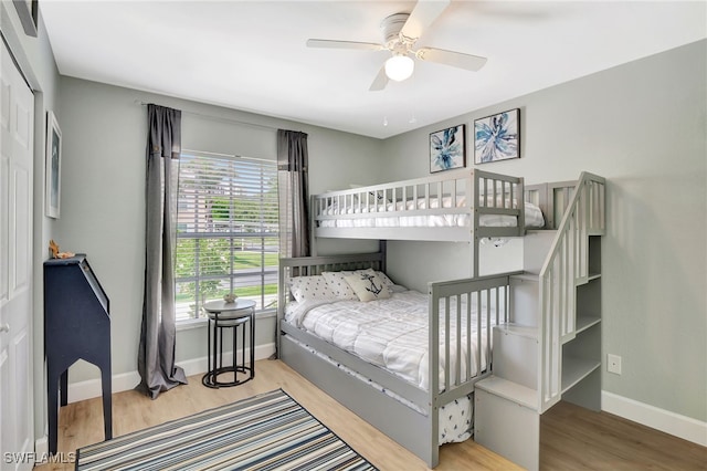 773 Wiggins Lake Dr Unit 101, Naples, FL 34110 - bedroom featuring baseboards, wood finished floors, and ceiling fan
