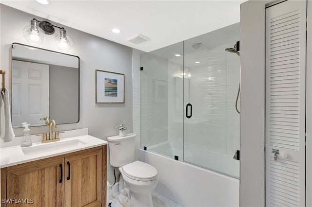 773 Wiggins Lake Dr Unit 101, Naples, FL 34110 - full bath featuring vanity, toilet, and shower / bath combination with glass door