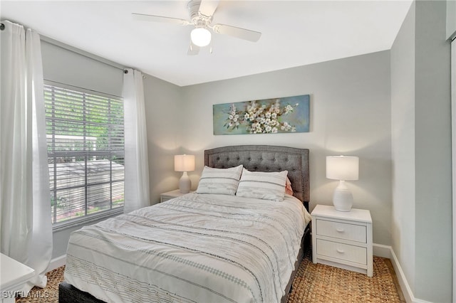 773 Wiggins Lake Dr Unit 101, Naples, FL 34110 - bedroom with baseboards and a ceiling fan