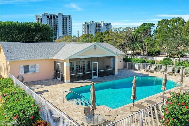 773 Wiggins Lake Dr Unit 101, Naples, FL 34110 - community pool featuring a patio and a sunroom