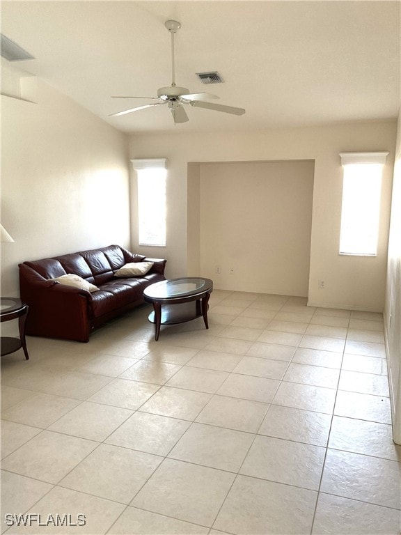 86 Pinehurst Pl, Rotonda West, FL 33947 - living area with healthy amount of natural light, a ceiling fan, and light tile patterned floors
