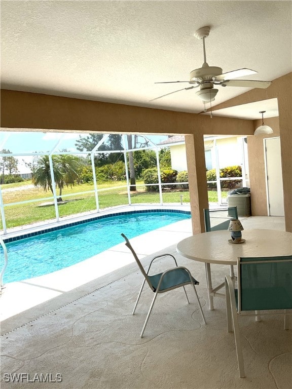 86 Pinehurst Pl, Rotonda West, FL 33947 - swimming pool featuring a patio, ceiling fan, a lanai, and a lawn