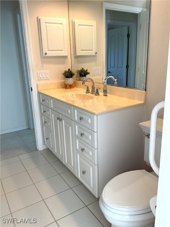 86 Pinehurst Pl, Rotonda West, FL 33947 - bathroom with vanity, toilet, and tile patterned floors