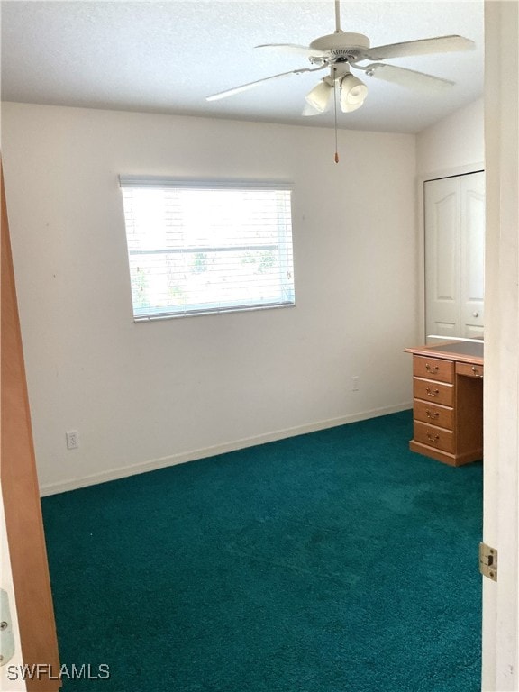 86 Pinehurst Pl, Rotonda West, FL 33947 - unfurnished bedroom with carpet flooring, ceiling fan, and baseboards