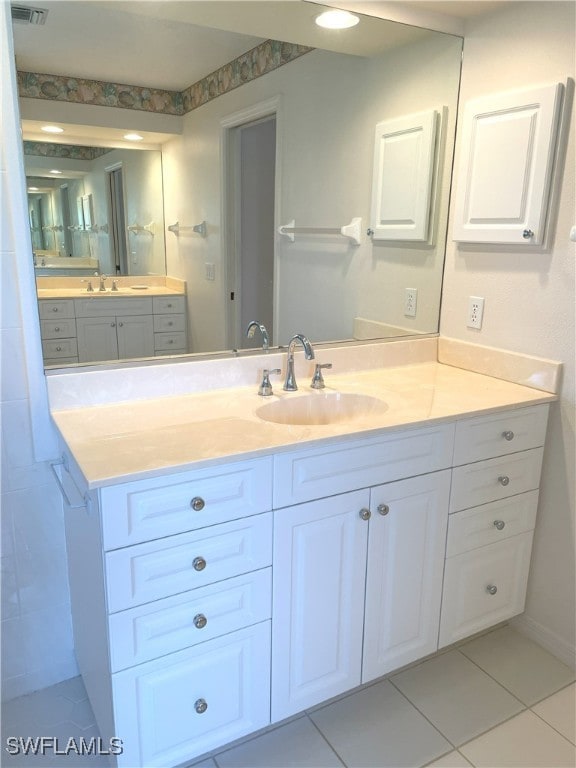 86 Pinehurst Pl, Rotonda West, FL 33947 - bathroom with vanity and tile patterned floors