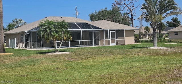 86 Pinehurst Pl, Rotonda West, FL 33947 - back of house with a lawn and a lanai