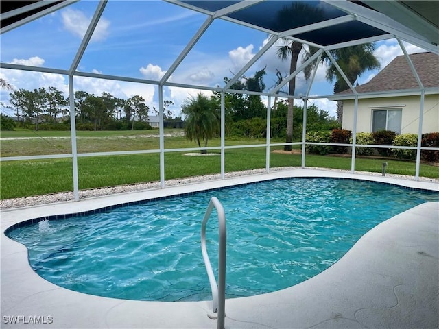 86 Pinehurst Pl, Rotonda West, FL 33947 - outdoor pool featuring glass enclosure and a yard