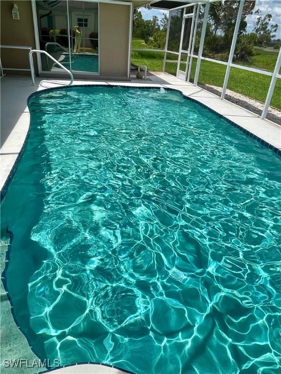 86 Pinehurst Pl, Rotonda West, FL 33947 - swimming pool featuring a patio and a lanai