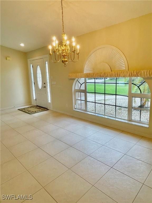 86 Pinehurst Pl, Rotonda West, FL 33947 - entrance foyer featuring light tile patterned flooring and a chandelier