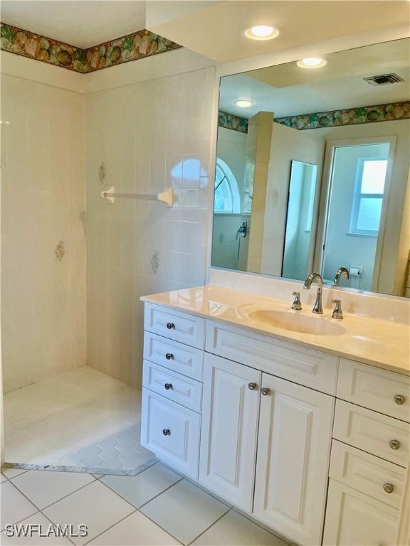 86 Pinehurst Pl, Rotonda West, FL 33947 - full bath with vanity and tile patterned floors