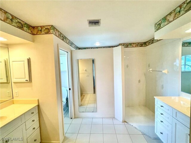 86 Pinehurst Pl, Rotonda West, FL 33947 - full bathroom featuring a walk in shower, vanity, and tile patterned floors