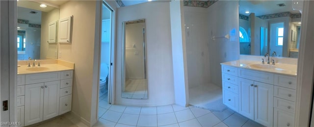 86 Pinehurst Pl, Rotonda West, FL 33947 - bathroom featuring two vanities and tile patterned floors