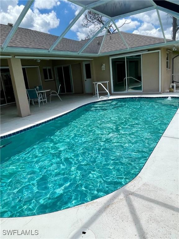 86 Pinehurst Pl, Rotonda West, FL 33947 - swimming pool featuring a patio area and a lanai