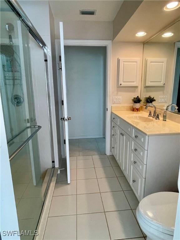 86 Pinehurst Pl, Rotonda West, FL 33947 - bathroom with vanity, a shower stall, tile patterned flooring, and recessed lighting