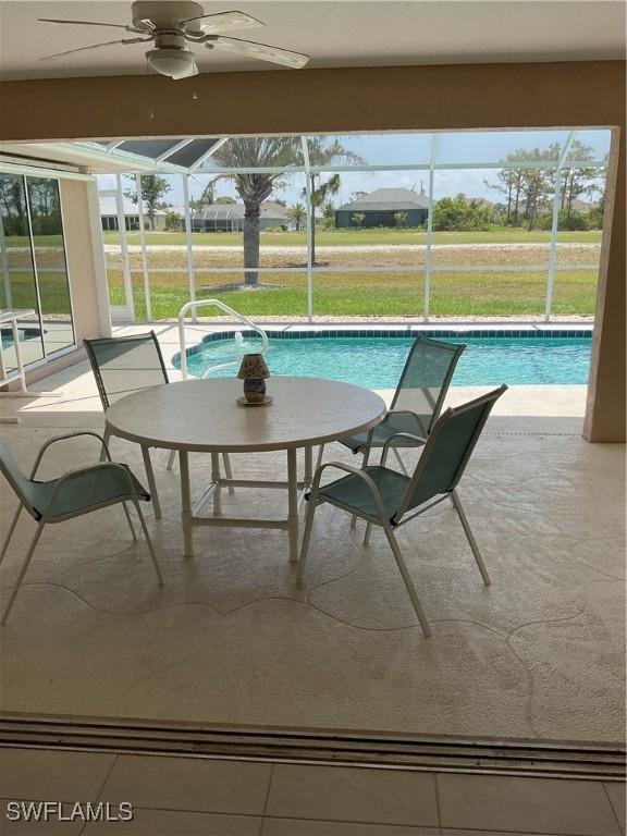 86 Pinehurst Pl, Rotonda West, FL 33947 - swimming pool with a lanai, a patio, and a lawn