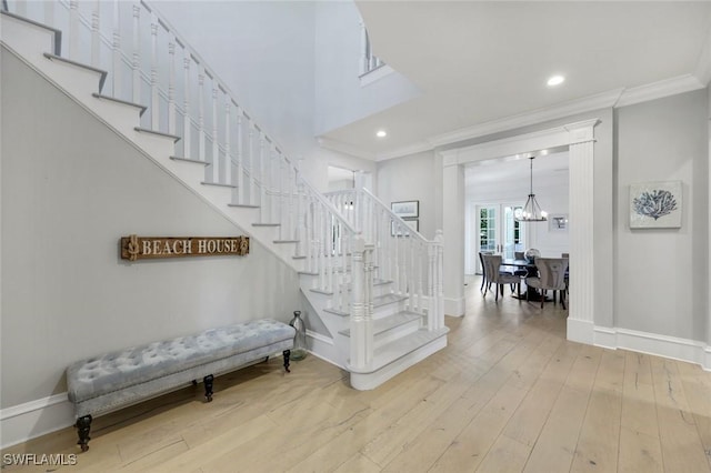 1550 Gordon Dr, Naples, FL 34102 - stairs with baseboards, a chandelier, crown molding, wood-type flooring, and recessed lighting
