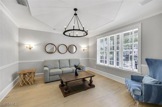 1550 Gordon Dr, Naples, FL 34102 - living room with a chandelier, crown molding, hardwood / wood-style floors, and baseboards