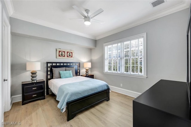 1550 Gordon Dr, Naples, FL 34102 - bedroom with crown molding, baseboards, light wood finished floors, and ceiling fan