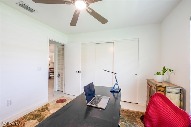 725 Grove Dr, Naples, FL 34120 - tiled home office featuring ceiling fan and baseboards