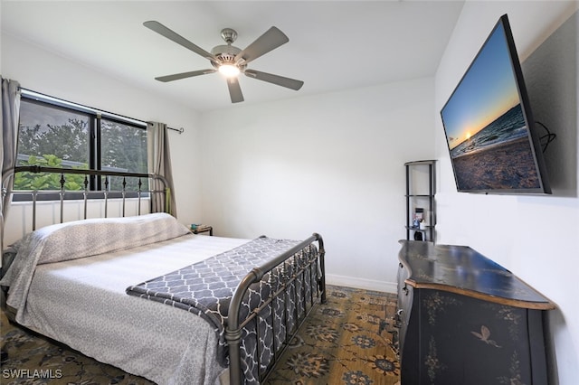725 Grove Dr, Naples, FL 34120 - bedroom featuring baseboards and a ceiling fan