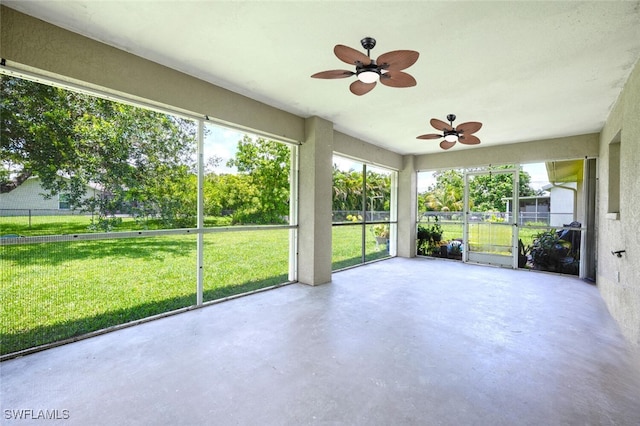 725 Grove Dr, Naples, FL 34120 - unfurnished sunroom featuring a ceiling fan