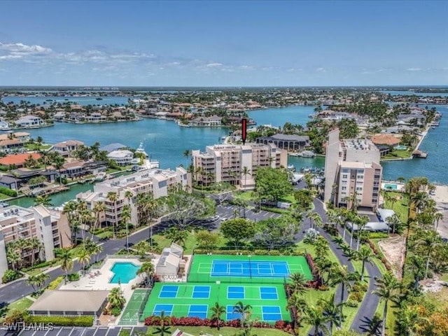 897 Collier Ct Unit 4-705, Marco Island, FL 34145 - drone / aerial view of a pool area and a large body of water