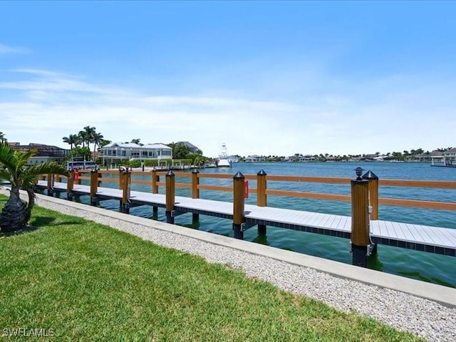 897 Collier Ct Unit 4-705, Marco Island, FL 34145 - dock featuring a water view and a lawn