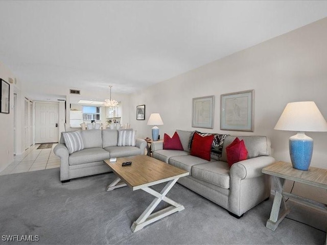 897 Collier Ct Unit 4-705, Marco Island, FL 34145 - living room with a chandelier and carpet flooring