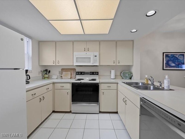 897 Collier Ct Unit 4-705, Marco Island, FL 34145 - kitchen with white appliances, a sink, light countertops, recessed lighting, and cream cabinets