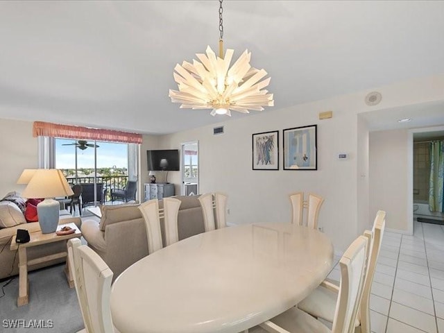 897 Collier Ct Unit 4-705, Marco Island, FL 34145 - dining area featuring light tile patterned floors and a chandelier