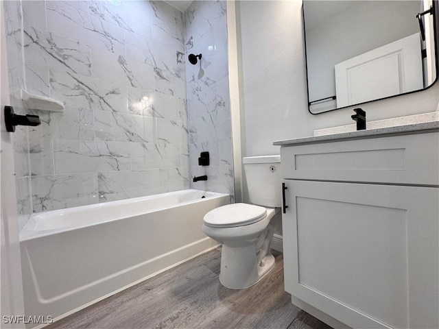 full bathroom featuring wood finished floors, toilet, vanity, and shower / bath combination