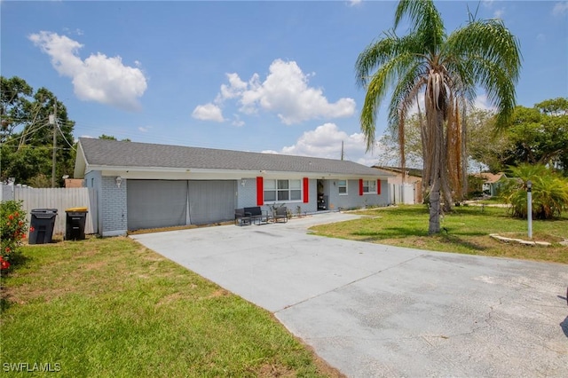221 Paine Dr, Winter Haven, FL 33884 - ranch-style house with an attached garage, driveway, and brick siding