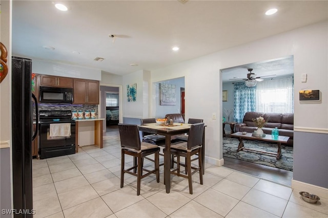 221 Paine Dr, Winter Haven, FL 33884 - dining room with light tile patterned floors, recessed lighting, baseboards, and ceiling fan