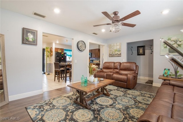 221 Paine Dr, Winter Haven, FL 33884 - living area featuring a ceiling fan, wood finished floors, recessed lighting, and baseboards