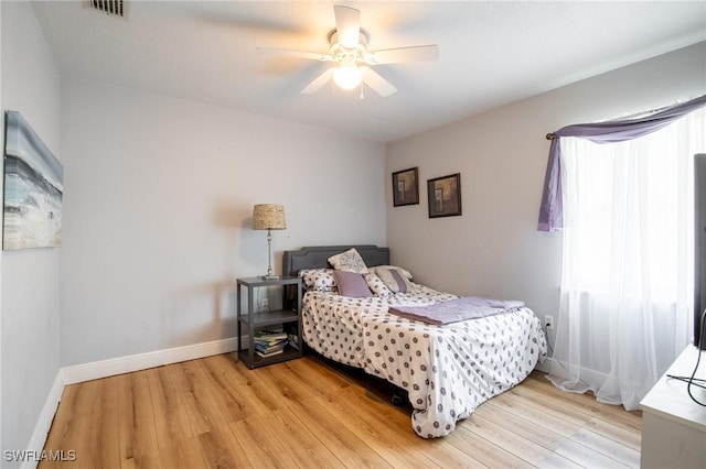 221 Paine Dr, Winter Haven, FL 33884 - bedroom with light wood finished floors, baseboards, and ceiling fan