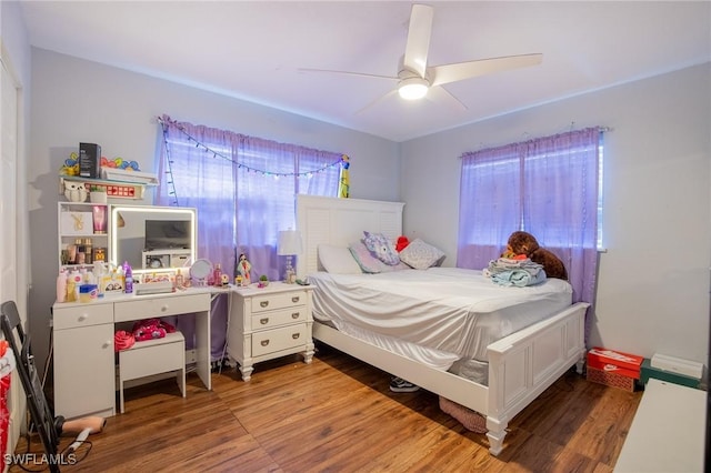 221 Paine Dr, Winter Haven, FL 33884 - bedroom featuring wood finished floors and a ceiling fan