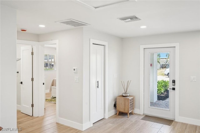 18195 Cutlass Dr, Fort Myers Beach, FL 33931 - foyer with healthy amount of natural light, light wood-style flooring, baseboards, and recessed lighting