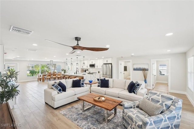 18195 Cutlass Dr, Fort Myers Beach, FL 33931 - living area featuring light wood-style floors, baseboards, recessed lighting, and a ceiling fan