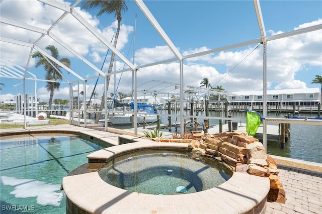 18195 Cutlass Dr, Fort Myers Beach, FL 33931 - view of swimming pool with a boat dock, boat lift, and glass enclosure