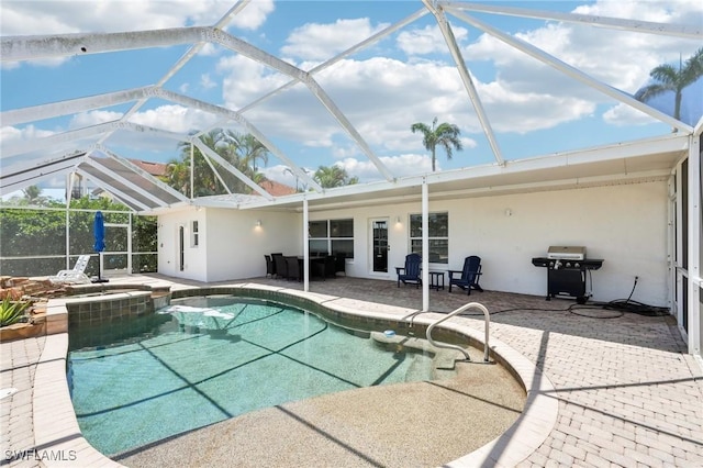 18195 Cutlass Dr, Fort Myers Beach, FL 33931 - view of swimming pool featuring a patio, area for grilling, a pool with connected hot tub, and glass enclosure