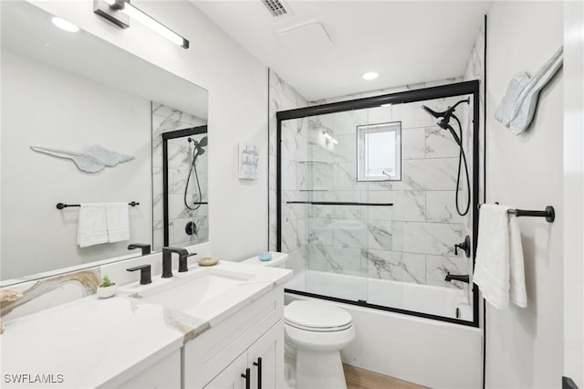 18195 Cutlass Dr, Fort Myers Beach, FL 33931 - full bathroom featuring combined bath / shower with glass door, vanity, toilet, and recessed lighting