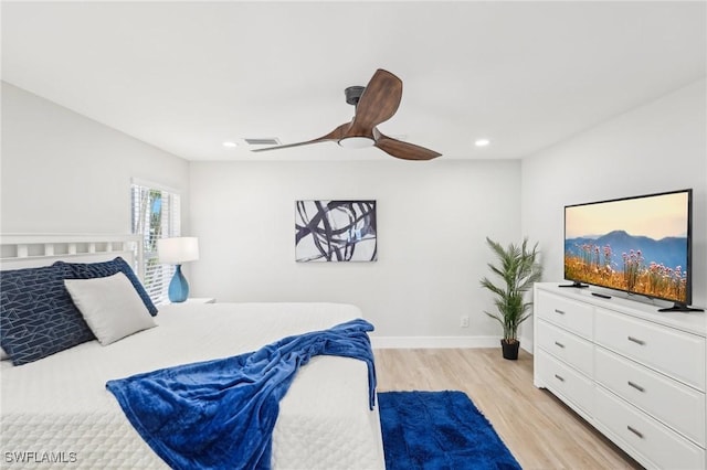 18195 Cutlass Dr, Fort Myers Beach, FL 33931 - bedroom featuring light wood-style flooring, recessed lighting, a ceiling fan, and baseboards