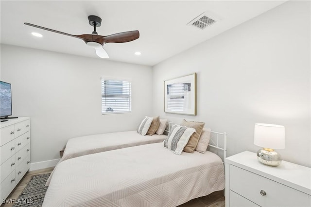 18195 Cutlass Dr, Fort Myers Beach, FL 33931 - bedroom with light wood finished floors, recessed lighting, ceiling fan, and baseboards