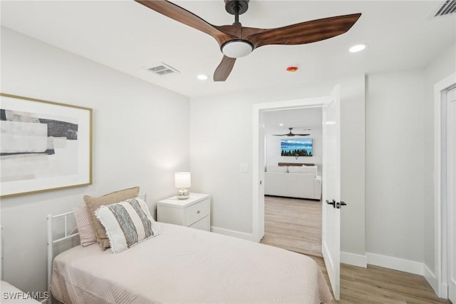 18195 Cutlass Dr, Fort Myers Beach, FL 33931 - bedroom with light wood-type flooring, baseboards, recessed lighting, and a ceiling fan