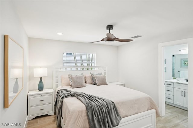18195 Cutlass Dr, Fort Myers Beach, FL 33931 - bedroom with light wood-type flooring, recessed lighting, ensuite bathroom, a ceiling fan, and a sink