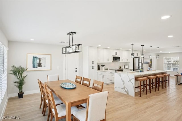 18195 Cutlass Dr, Fort Myers Beach, FL 33931 - dining room featuring light wood finished floors, recessed lighting, and baseboards